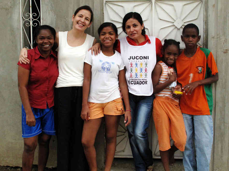 Sylvia Reyes (second from left), leader of Juconi in Guayaquil, with the Angulo family. She and Martha Espinoza (fourth from left) have worked with the family for more than  six years, helping with everything from nutrition to emotional health.