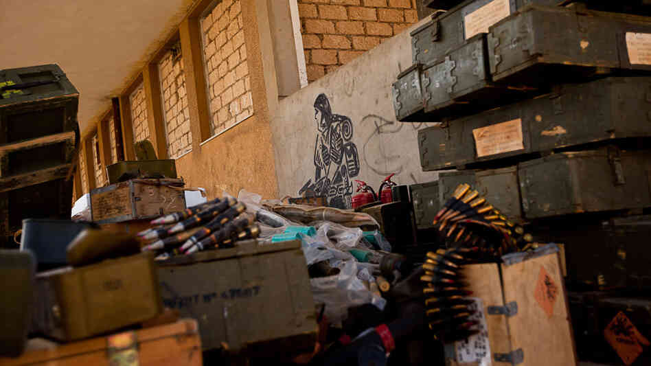 Ammunition and weapons are scattered around an arms depot in Ajdabiya, Libya, on Tuesday. Ammunition and weapons are scattered around an arms depot in Ajdabiya, Libya, on Tuesday.