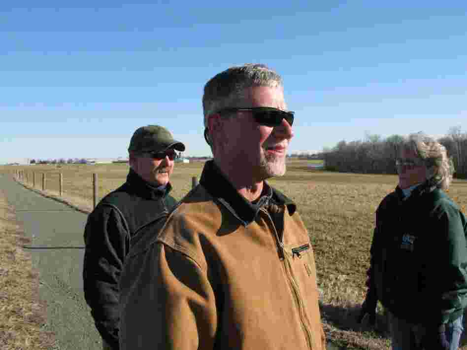 "We just make sure we're meeting the letter of the organic regulations to the T," says Tom Spohn (foreground), director of dairy operations for Horizon Organic. Behind him are farm manager Dudley McHenry and Sissy Everett.