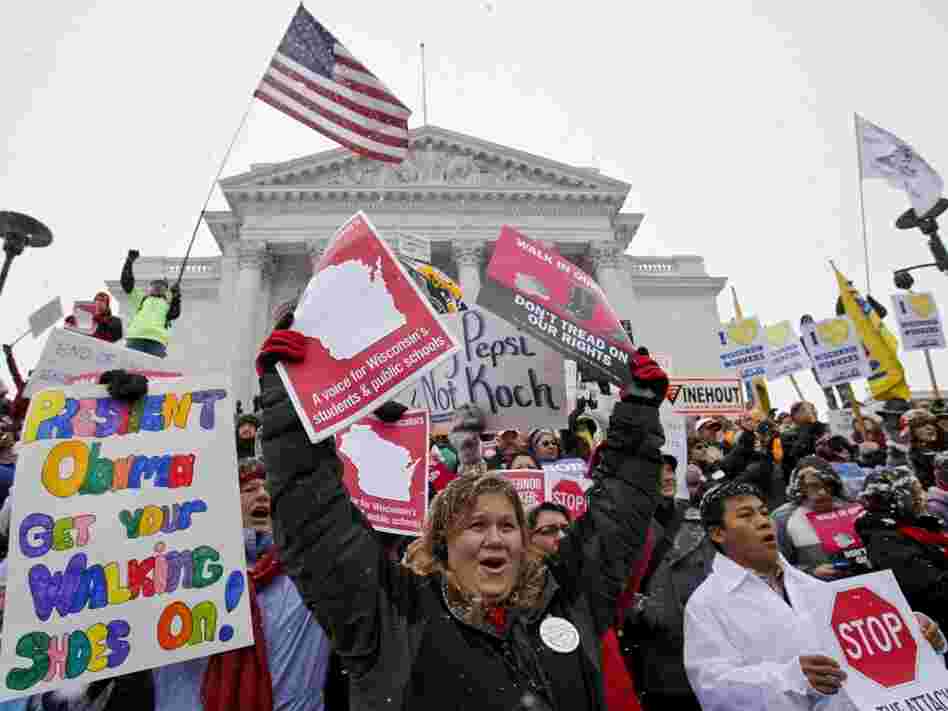 Teacher Kristen Henningfeld, center, of Elk Mound, Wis., protests on the  steps of the state Capitol in Madison, Wis., on Feb. 26.