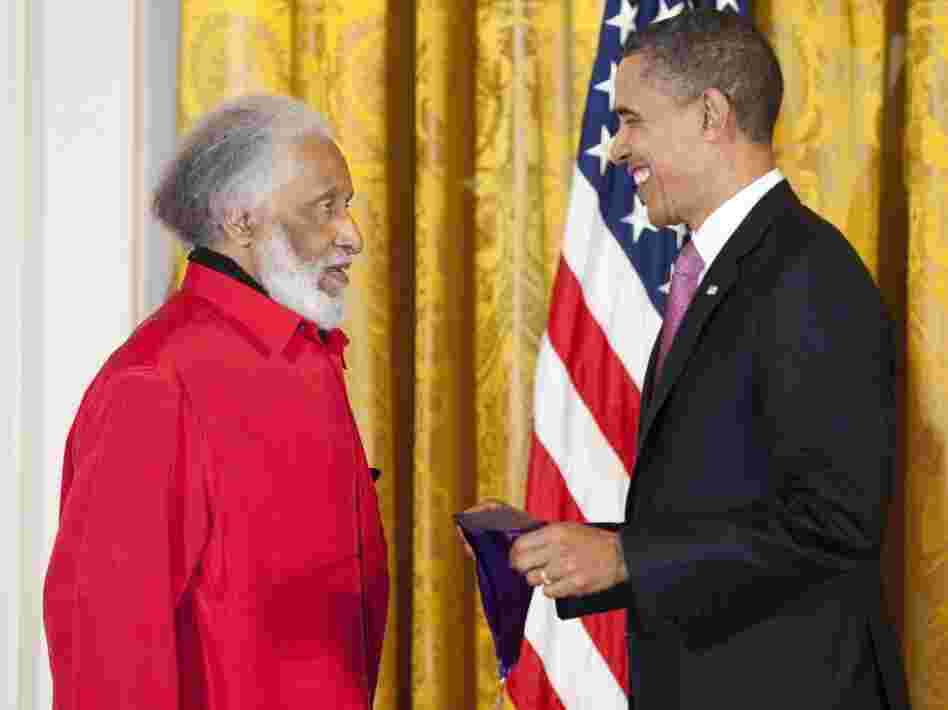 President Barack Obama presents Sonny Rollins with his National Medal of Arts.