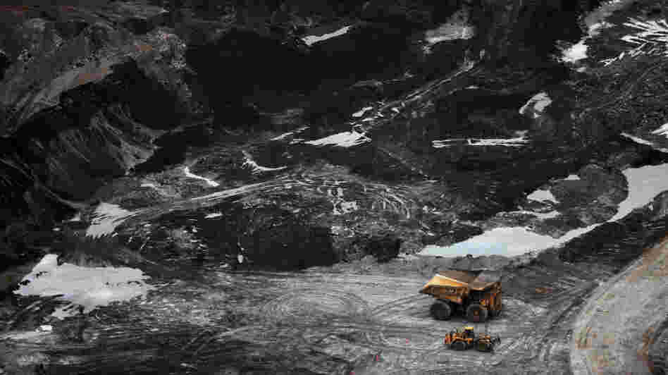 Rising crude oil prices and improved extraction methods have made exploitation of Canada's oil sands more economical. Here, a view of an oil sands mine near Fort McMurray, Alberta. Rising crude oil prices and improved extraction methods have made exploitation of Canada's oil sands more economical. Here, a view of an oil sands mine near Fort McMurray, Alberta.