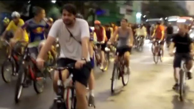 A video screengrab shows riders in the Critical Mass bike ride last Friday, seconds before a car sped through the Porto Alegre street.