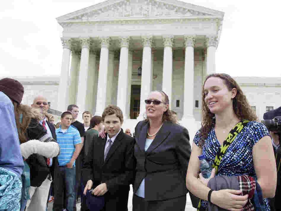 Margie Phelps, second from right, a daughter of Fred Phelps, and the lawyer who argued the case for the Westboro Baptist Church, walks from the Supreme Court last October. The Supreme Court has ruled that the First Amendment protects the fundamentalist church's attention-getting, anti-gay protests outside military funerals.