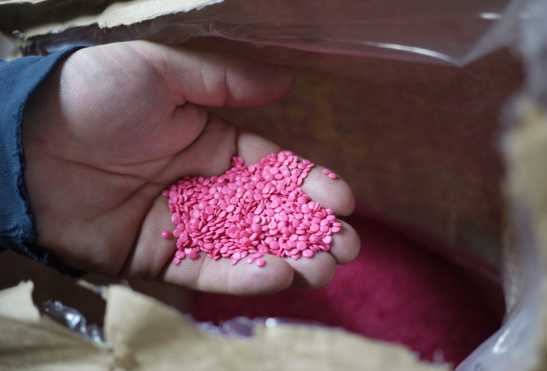The newest press at EKS makes colored specialty vinyl, which begins its life as tiny pellets of polyvinyl chloride in pink, blue, red, green, white or black.
