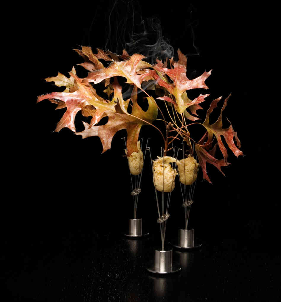 Alinea's version of pheasant, served with shallot, cider gel and burning oak leaves.