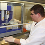 Nomar Bodon, a senior research assistant for CertiChem, a PlastiPure partner, tests samples of plastics and prepares them for an automated cell assay. The assay is used to determine if the material has estrogenic activity.