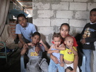 Maribel Olmedo sits in her house, surrounded by some of her children, including Hamilton (from left), 16, Jonathan, 12, Pierina, 2, and Jose, 1. The family struggles to make ends meet, but Olmedo says she is grateful her children are alive. Maribel Olmedo sits in her house, surrounded by some of her children, including Hamilton (from left), 16, Jonathan, 12, Pierina, 2, and Jose, 1. The family struggles to make ends meet, but Olmedo says she is grateful her children are alive.