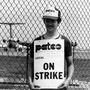 Striking air traffic controllers stand on a picket line as an airliner taxis on the runway behind them at New York's La Guardia Airport, Aug. 6, 1981. Striking air traffic controllers stand on a picket line as an airliner taxis on the runway behind them at New York's La Guardia Airport, Aug. 6, 1981.