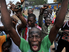 Residents gather on the street where security forces loyal to disputed incumbent leader Laurent Gbagbo, opened fire on demonstrators, killing at least six women on March 3. Residents gather on the street where security forces loyal to disputed incumbent leader Laurent Gbagbo, opened fire on demonstrators, killing at least six women on March 3.