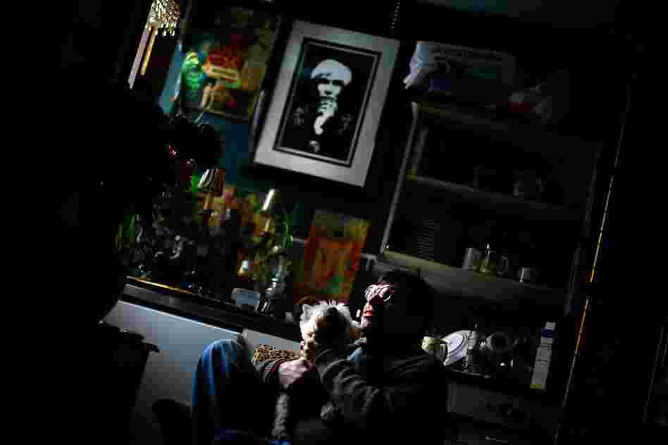Martin Michael Fitzgerald III sits in his studio apartment with his dog Miss Lilibet.