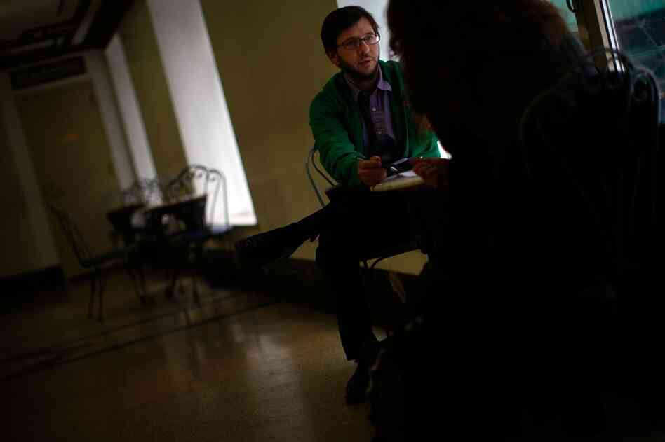 John Alter, intake coordinator for the Times Square Building, interviews a prospective tenant. There are no longer any chronically homeless people living in Times Square.