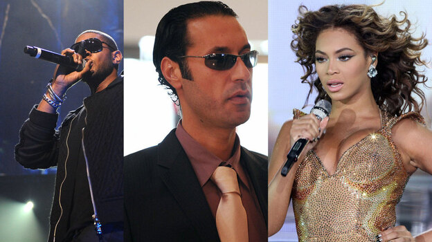 Usher (left) and Beyonce (right) performed at private concerts funded by the family of Libyan President Moammar Gadhafi. Gadhafi's son Hannibal is at center. (Getty Images)
