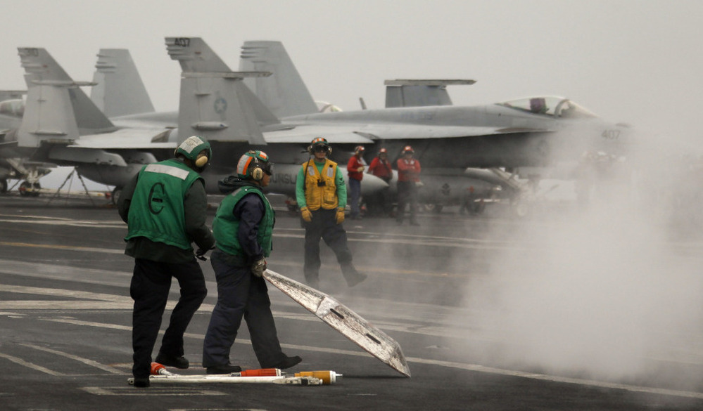 U.S. sailors on USS Harry S Truman aircraft carrier's flight deck in the Mediterranean Sea,  June 14, 2010.