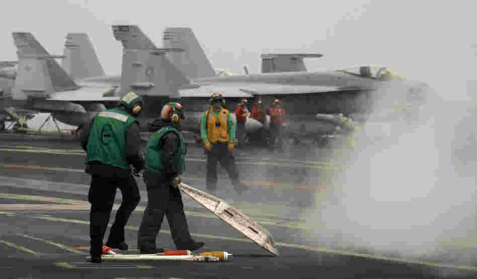 U.S. sailors on USS Harry S Truman aircraft carrier's flight deck in the Mediterranean Sea,  June 14, 2010.