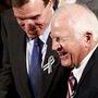 Sens. Mark Warner (D-VA, left) and Saxby Chambliss (R-GA), shown before the start of President Obama's State of the Union address in January. The two senators are part of the so-called Gang of Six — a bipartisan group that hopes to break a deadlock and reduce the federal deficit.