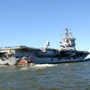The aircraft carrier USS Enterprise, shown departing from Naval Station Norfolk on Jan. 13, is now in the Red Sea, with its dozens of warplanes, waiting to see if it's needed for any Libyan operation. The aircraft carrier USS Enterprise, shown departing from Naval Station Norfolk on Jan. 13, is now in the Red Sea, with its dozens of warplanes, waiting to see if it's needed for any Libyan operation.
