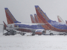Southwest Airlines planes sat idle at Love Field airport in Dallas as snow fell on Feb. 4, 2011. Southwest Airlines planes sat idle at Love Field airport in Dallas as snow fell on Feb. 4, 2011.