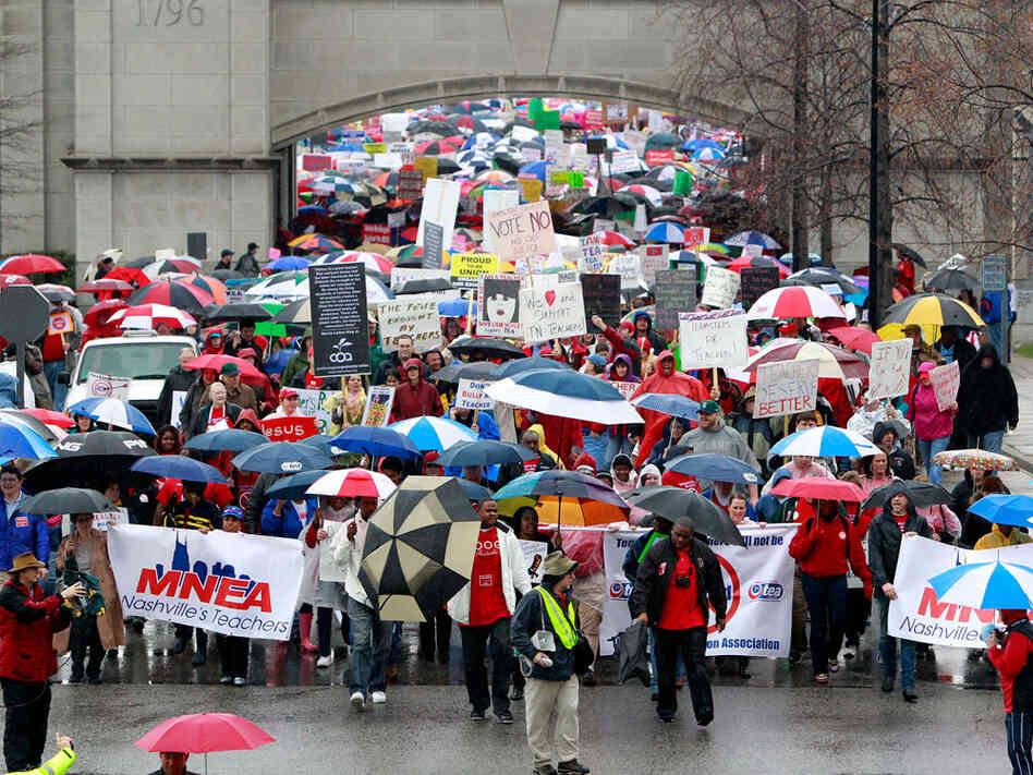 People opposing legislative efforts to do away with teachers' collective bargaining rights march to the Legislative Plaza for a March 5 rally in Nashville, Tenn. Protesters from the Tea Party as well as the Tennessee Education Association converged on the state Capitol to voice competing views on the issue. People opposing legislative efforts to do away with teachers' collective bargaining rights march to the Legislative Plaza for a March 5 rally in Nashville, Tenn. Protesters from the Tea Party as well as the Tennessee Education Association converged on the state Capitol to voice competing views on the issue.