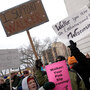 Labor and union supporters protest alongside supporters  of Wisconsin governor Scott Walker outside the State Capitol on Saturday  in Madison.