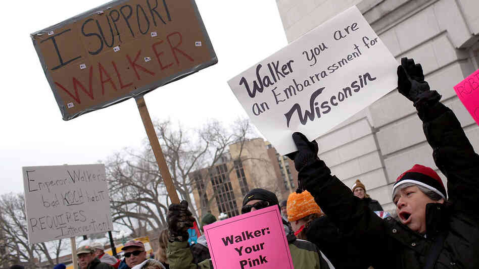 Labor and union supporters protest alongside supporters of Wisconsin governor Scott Walker outside the State Capitol on Saturday in Madison. Labor and union supporters protest alongside supporters of Wisconsin governor Scott Walker outside the State Capitol on Saturday in Madison.