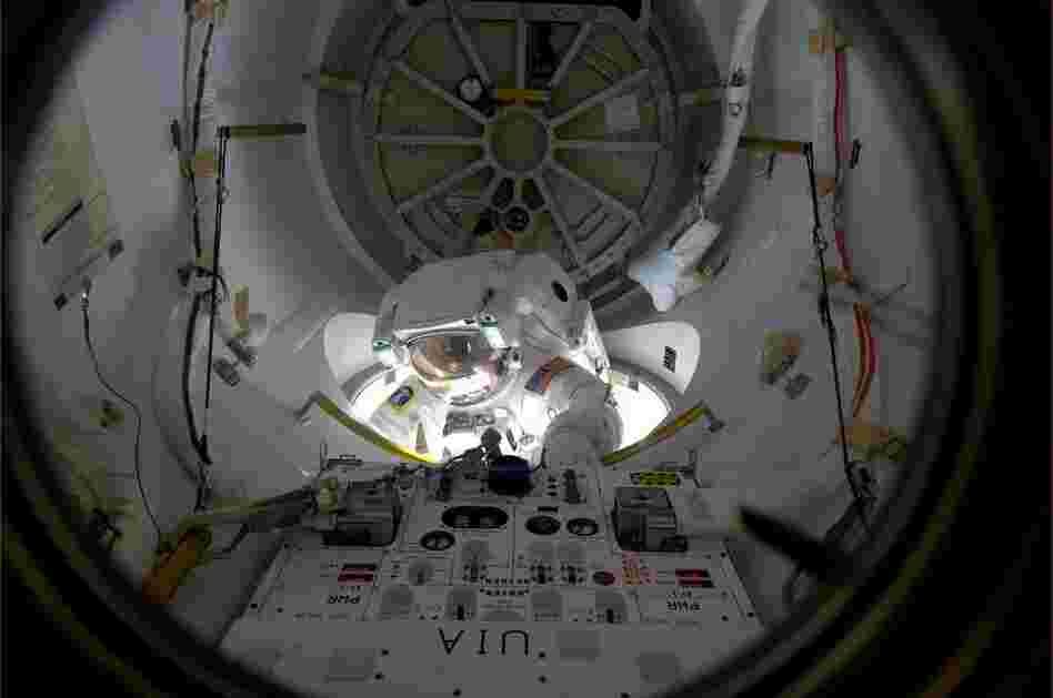 Alvin Drew emerges from an airlock on the space station on Feb. 28. Drew was the 200th person to perform a spacewalk.