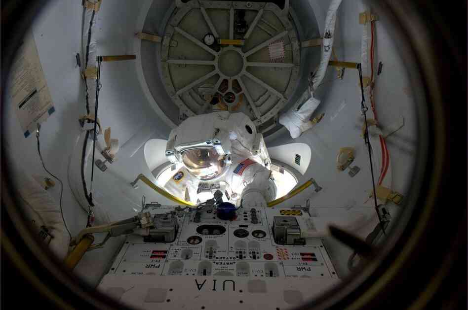 Alvin Drew emerges from an airlock on the space station on Feb. 28. Drew was the 200th person to perform a spacewalk.