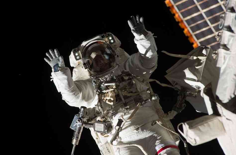 During the mission, astronaut Steve Bowen performed a spacewalk with fellow astronaut Alvin Drew to fix a pump on the International Space Station. Bowen is seen here strapped to a robotic arm.