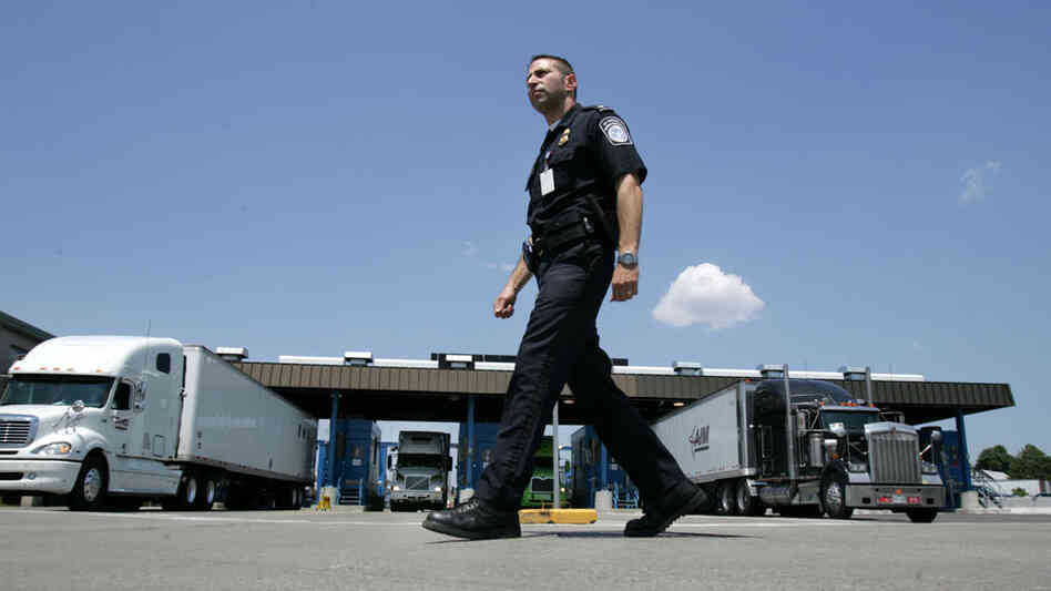 U.S. Customs and Border Protection officer Kevin Corsaro walks past a truck inspection station at the U.S. border in Buffalo, N.Y., in 2006. U.S. Customs and Border Protection officer Kevin Corsaro walks past a truck inspection station at the U.S. border in Buffalo, N.Y., in 2006.
