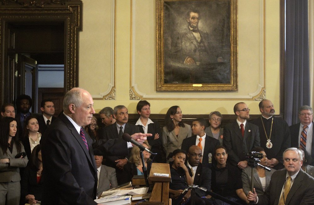 Illinois Gov. Pat Quinn speaks with reporters after signing legislation abolishing the death penalty in the state at the capitol in Springfield on Wednesday.