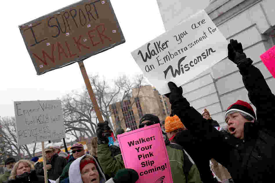 Labor and union supporters protest alongside supporters of Gov. Walker outside the state Capitol. 