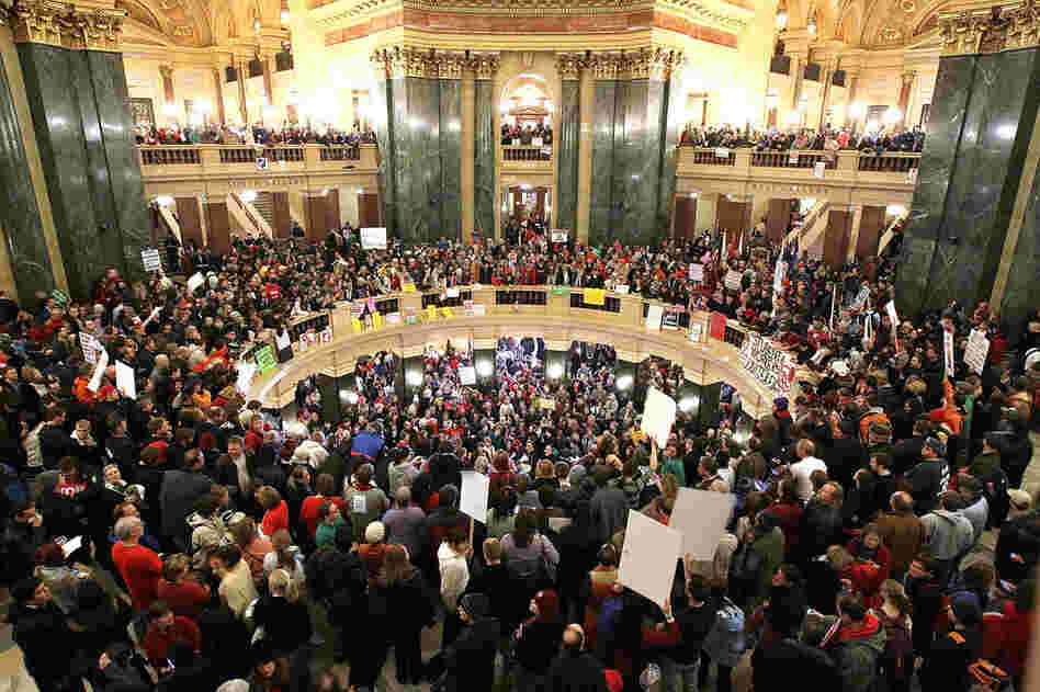 Protesters fill the Wisconsin state Capitol after Republican state senators voted to curb collective bargaining rights for public union workers. 