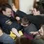 Wisconsin police tried to secure a door inside the state Capitol as thousands of angry people mobbed the area in anticipation of Thursday's Assembly vote.