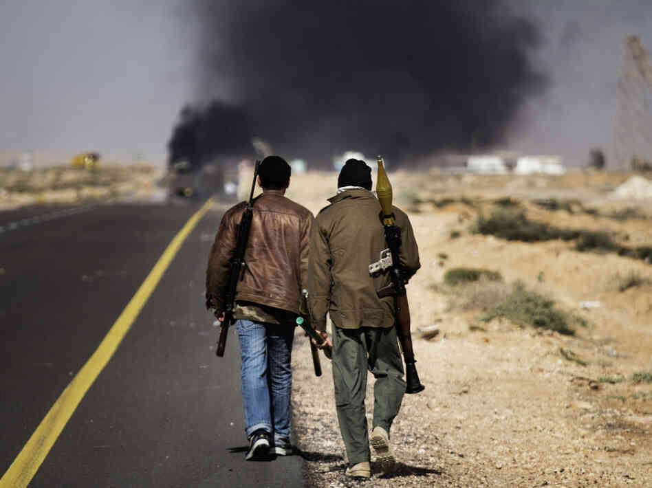 Smoke billows from the fighting in Sidra, 6 miles west of Ras Lanuf.