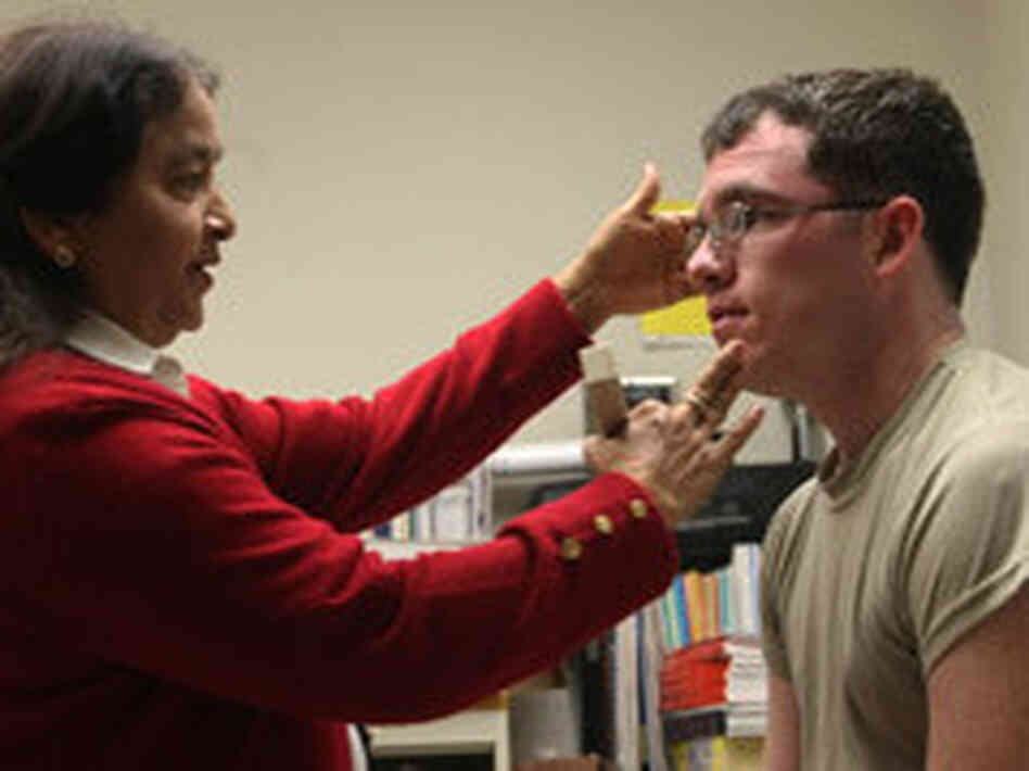 Spc. Joseph Chroniger, who has bone spurs in his neck, hopes acupuncture from Dr. Shashi Kumar at Madigan Army Medical Center will give him relief from pain. Spc. Joseph Chroniger, who has bone spurs in his neck, hopes acupuncture from Dr. Shashi Kumar at Madigan Army Medical Center will give him relief from pain.