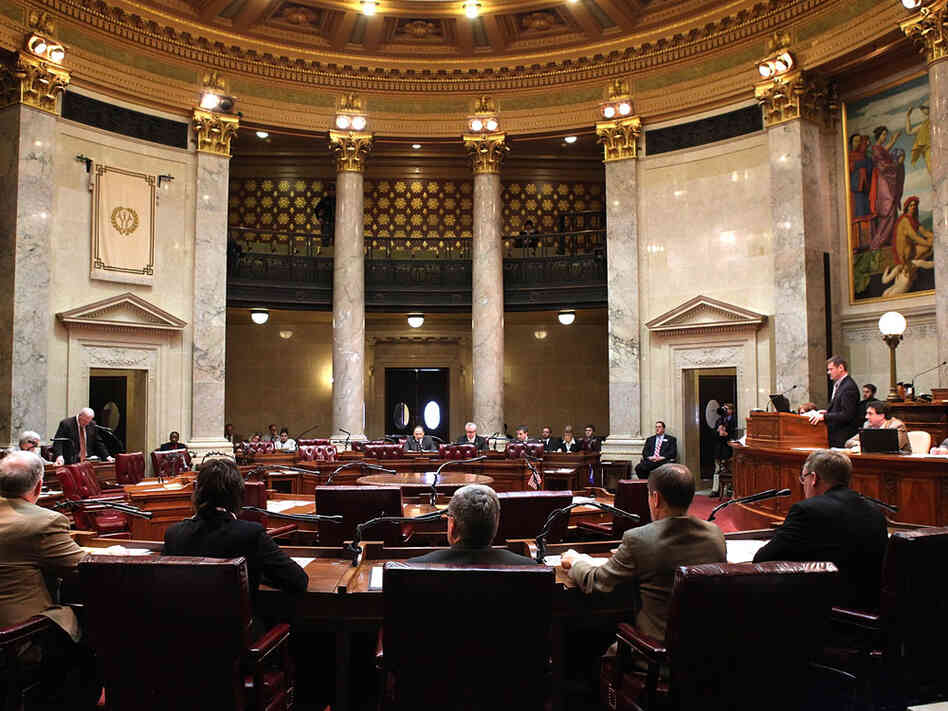 Democrats' chairs sat empty during the Senate vote on Gov. Scott Walker's legislation that would restrict collective bargaining for most government workers in Wisconsin. Republicans voted 18-1 to pass the bill. Democrats' chairs sat empty during the Senate vote on Gov. Scott Walker's legislation that would restrict collective bargaining for most government workers in Wisconsin. Republicans voted 18-1 to pass the bill.