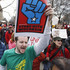 Michael Deahn, center, joins protestors in Washington, Saturday, Feb. 26, 2011, during a 'Rally to Save the American Dream', in support of the workers of Wisconsin fighting a measure that would require government workers to contribute more to their health care and pension costs and largely eliminate their collective bargaining rights.