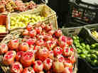 An Iraqi cuts a pomegranate on his fruit stall at the Al-Shorja market, central Baghdad, in 2007. In her book Day of Honey, author Annia Ciazadlo says she visited the local Bagdhad markets when first arriving as a reporter in order "to to comprehend the place I've landed in, to touch and feel and take in the raw materials of my new surroundings."