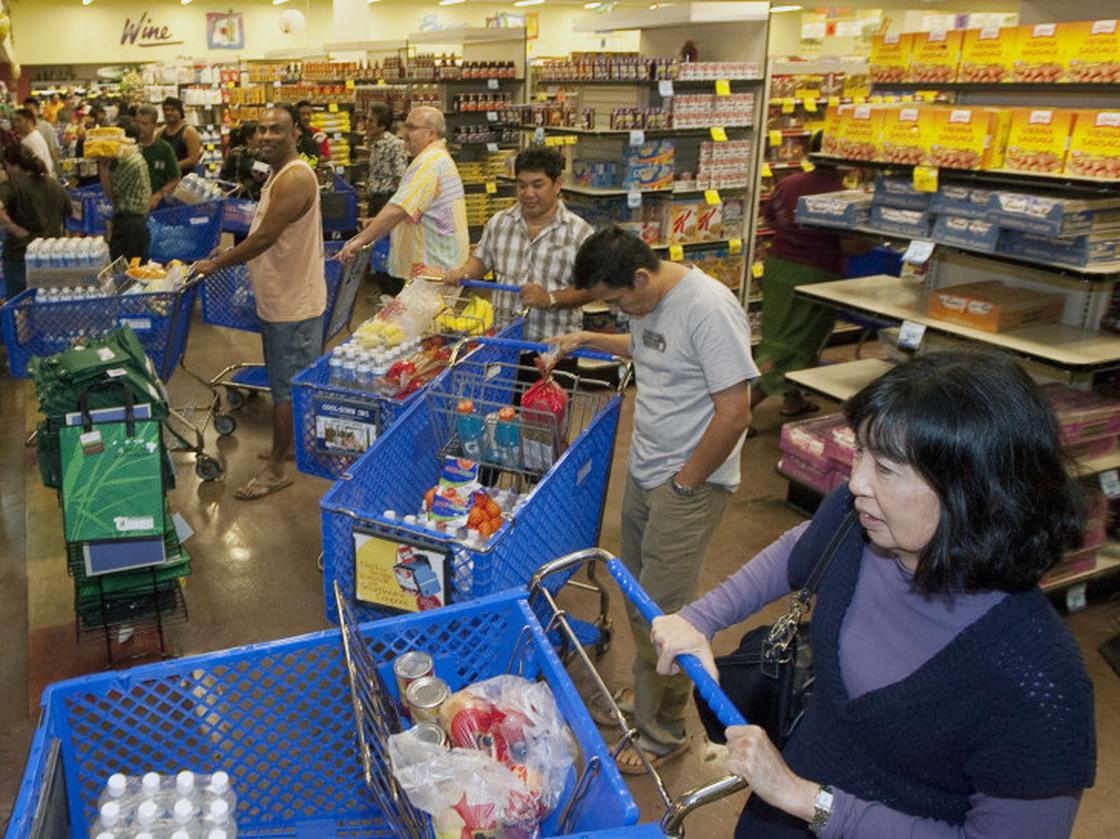 Shoppers buy water and supplies in Honolulu on Thursday, in advance of a tsunami triggered by a massive earthquake in Japan.