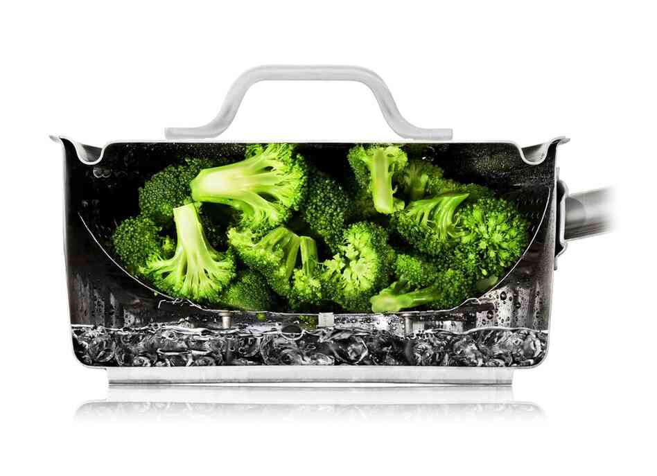 The cutaway photos — like this one of broccoli steaming — are all real. The Modernist Cuisine team arranged food in the cut-in-half equipment and then took photos.  In most cases, the food is really being cooked as shown.
