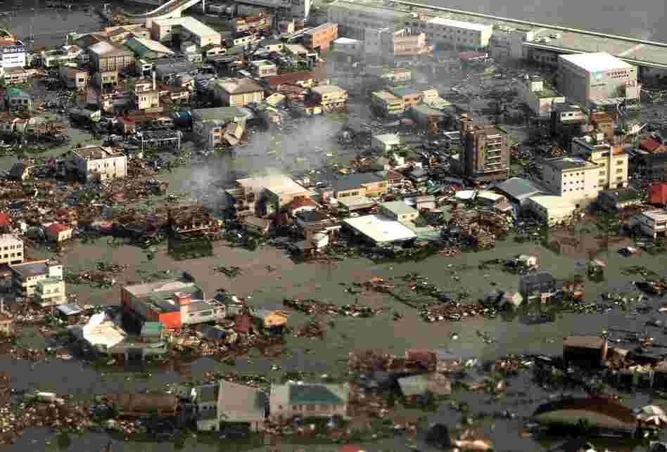 An aerial view of the devastated city of Kesennuma in Japan's Miyagi prefecture on Saturday. A tsunami unleashed by a massive quake wreaked destruction across northeast Japan. 