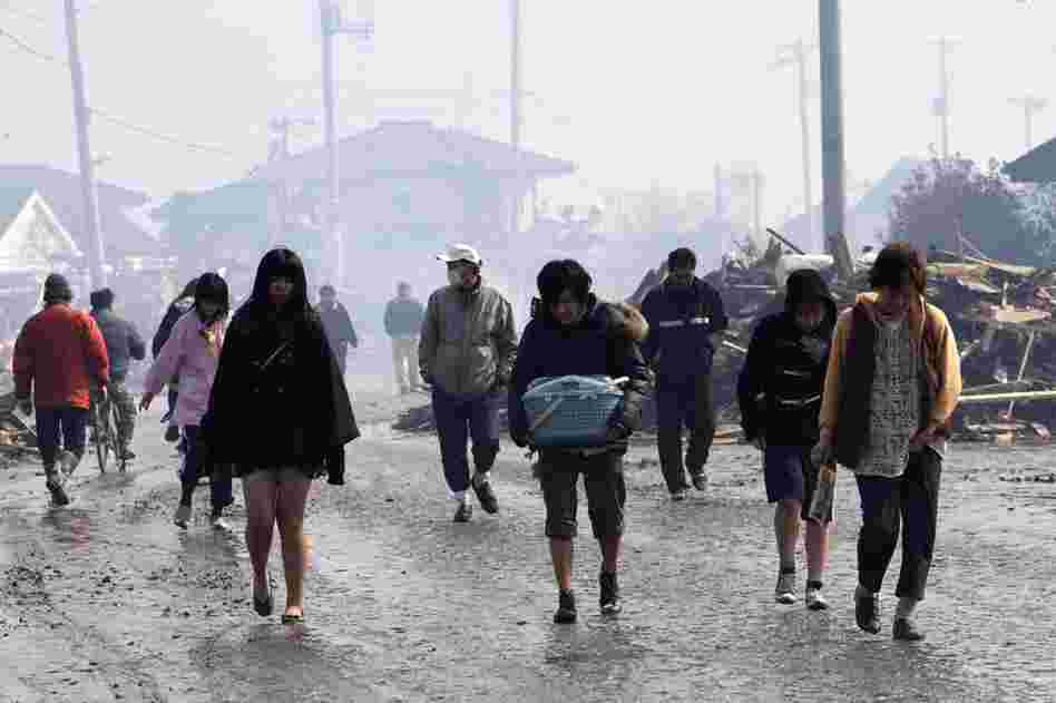 Natori city in northeast Japan is evacuated Saturday. More than 1,000 people are feared dead. 