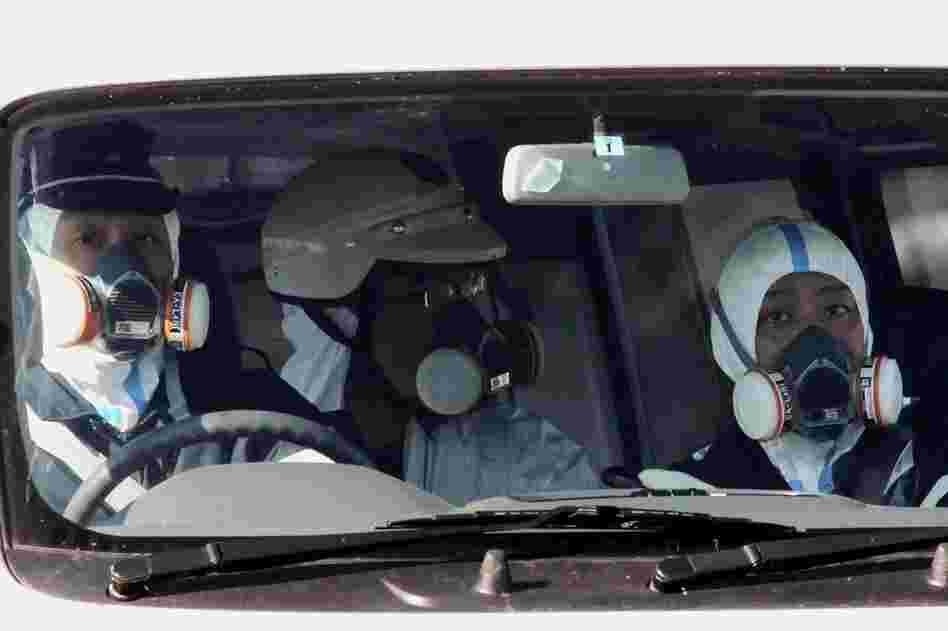 Police officers patrol near the nuclear power plant in Fukushima on Saturday. 