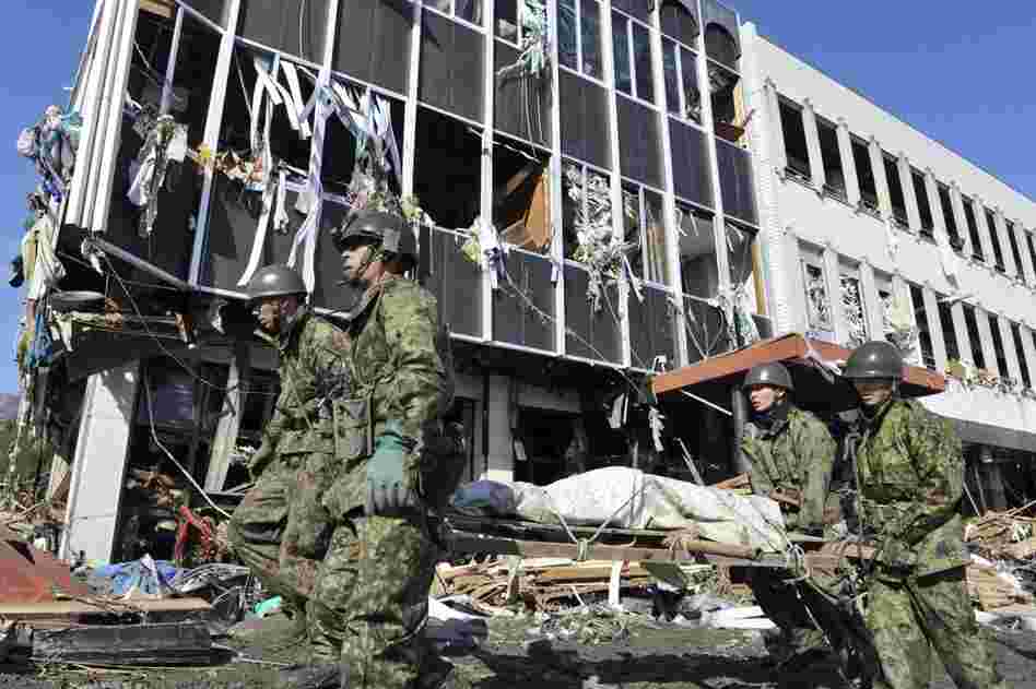 Japanese soldiers carry out  rescue operations in Rikuzentakata on the northern coast. 