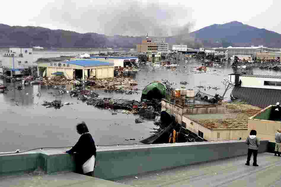 A warehouse and vehicles were washed away in Kesennuma, northern Japan. 
