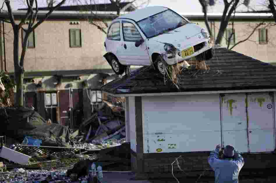 A car sits on a roof in Sendai. 