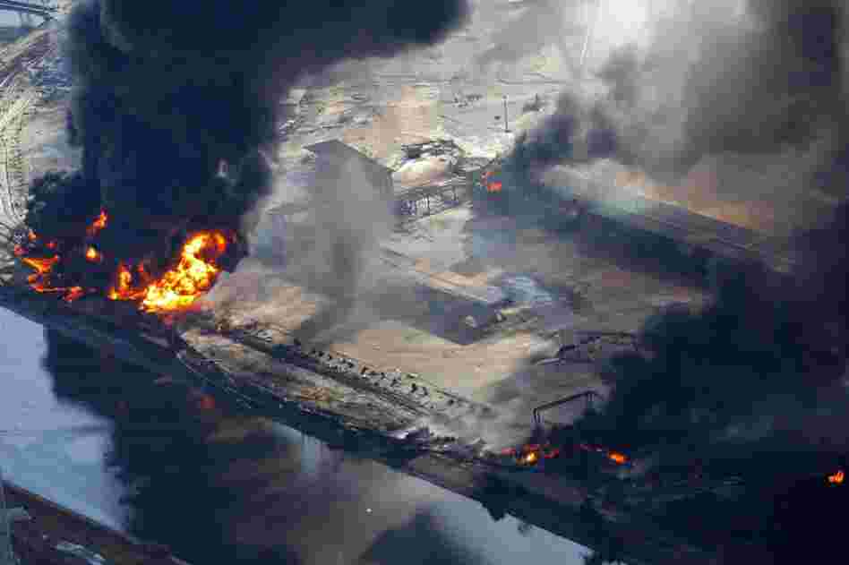 An industrial area burns in Sendai. 