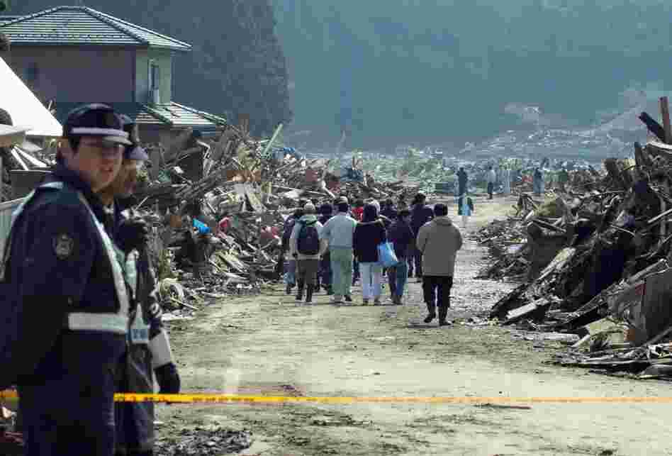 Residents return to a restricted area to look at their quake-damaged homes in Miyagi prefecture on Sunday. 