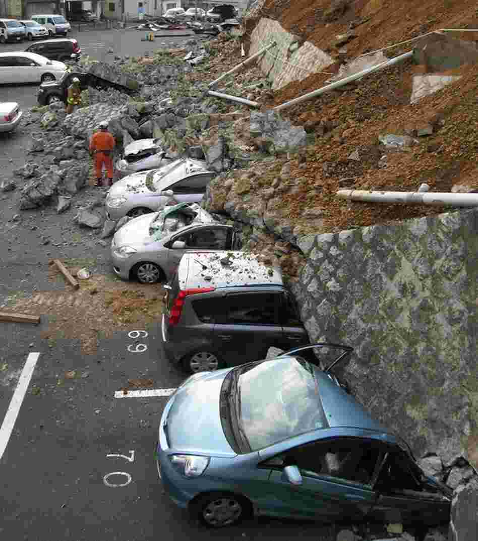 A collapsed wall crushed vehicles at a parking lot in Mito city, about 80 miles north of Tokyo. 