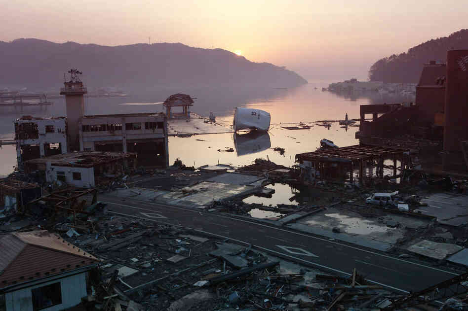 Debris litters the town of Onagawa town in Miyagi prefecture at dawn. 